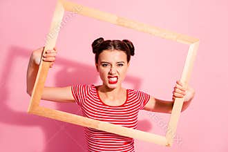 Portrait of her she nice-looking cute charming attractive lovely bossy selfish girl in striped t-shirt holding in hands