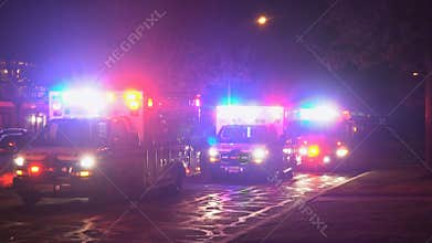 Sayreville NJ USA April 01 2019 Night housing community development street paramedic ambulance emergency lights flashing