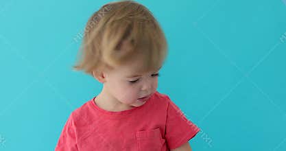 Little boy waving her head and saying no