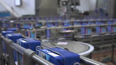 Conveyor line at the dairy plant.Dairy products in paper packaging