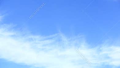 Clouds drifting in blue skies