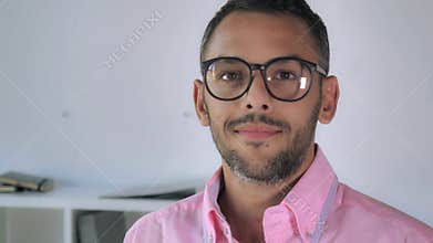 Mixed race guy with glasses closeup.