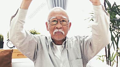 Front view of two thumps up from old asian man.