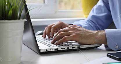 White collar worker working at office on laptop computer