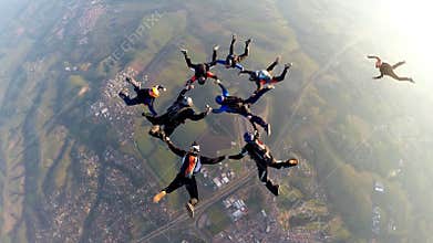 Skydivers at the sunset