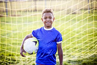 Diverse young boy on a youth soccer team