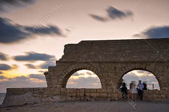 Roman age aquaeductus in Caesarea in sunset