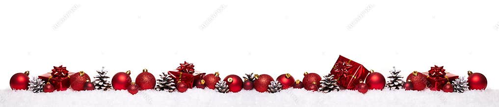 Red christmas balls with xmas present gift boxes in a row isolated on snow