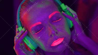 Woman with UV fluorescent makeup