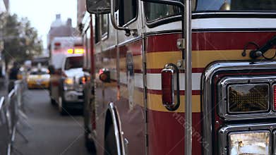 Close-up view of emergency service cars standing on the road. Accident in the city. Fire vehicle going work.