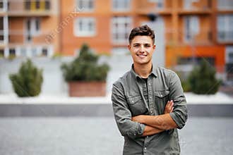 Handsome smiling young man portrait. Cheerful man looking at camera