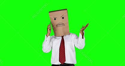 Angry anonymous businessman talking on cellphone