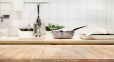 Wood table top on blur kitchen room background