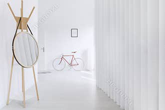 Round mirror in minimalist hall