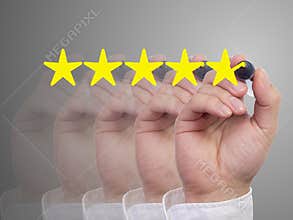Five fading hands with a pen giving a five star review