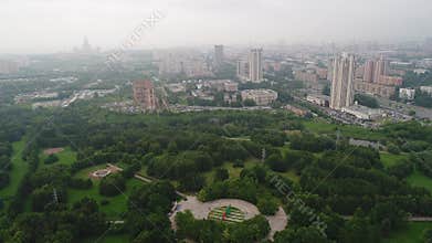 View from the height to the foggy city and park