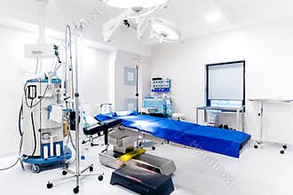 Empty operating room, life care support, operating table, lamps and medical equipment