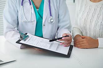 Doctor and patient, close-up of hands. Physician talking about medical examination results. Medicine, healthcare an