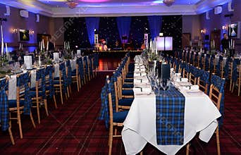 Laid dinner tables at formal event