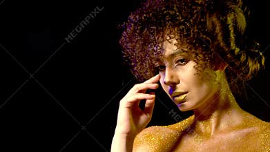 Horoscope woman with golden powder cosmetics on bare shoulders.