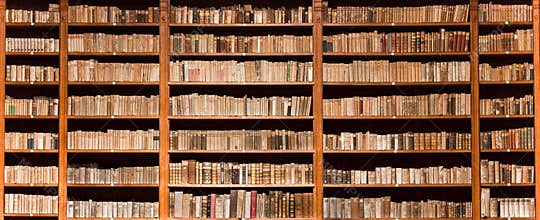 Old books in wooden bookcase