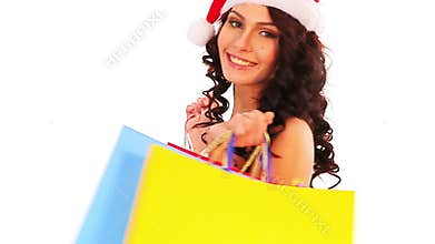 Christmas sale for shopping woman in Santa hat holding bag.