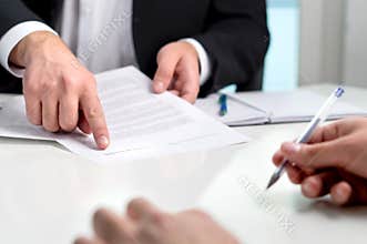 Signing a contract or agreement.