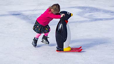 Young Girl Learning to Ice Skate