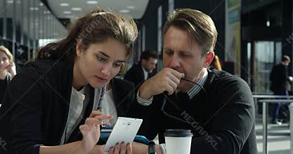 Business people browsing phone