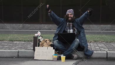 Funny homeless beggar winning a fortune online