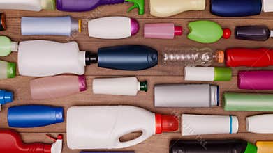 Plastic waste bottles filling a table sliding through screen