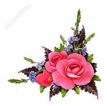 Floral corner arrangement with begonia and small blue flowers