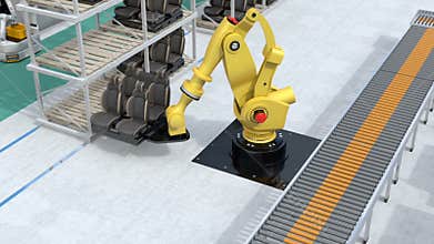 Yellow heavyweight robotic arm carrying vehicles seats for assembly