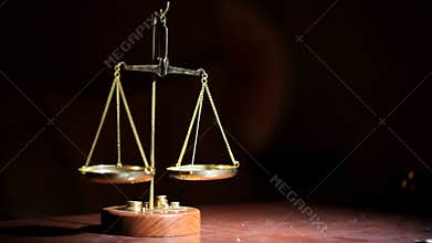 The scales are unsteady until they balance