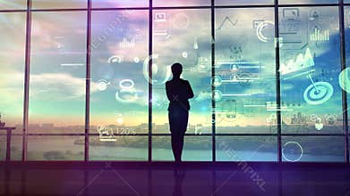 A woman watches charts and data of business processes