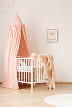 Girly infant room with crib