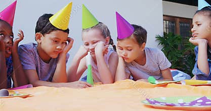 Upset kids lying in the backyard of house 4k
