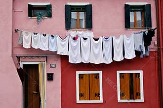 Drying clothes on a house in Burano, Italy