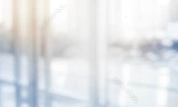 Blurred abstract grey glass wall building background.