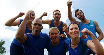 Group of fit people cheering together in boot camp 4k