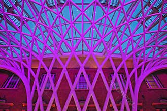 Unique Structure at Concourse of London King Cross Railway Station against the brick brown building