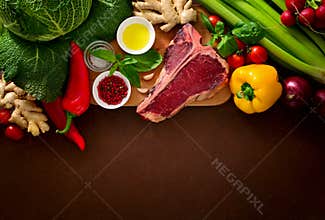 Culinary background with fresh vegetables and meat