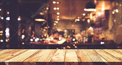 Wood table top Bar with blur night cafe background