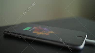 Closeup Mobile Phone Charging with Battery Charger.
