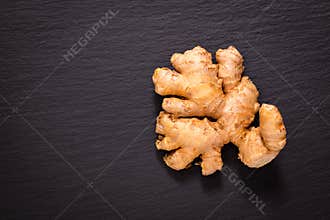 Healthy food concept Organic Ginger on black slate stone plate w