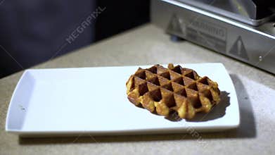 Waffles are taken from a waffle iron / cooked waffles