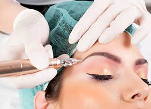 Applying Permanent Makeup for Eyebrows: Beautician\'s Eyebrow Tattooing for Female Face