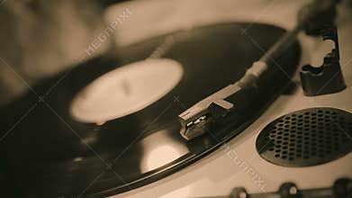 Old vinyl record playing on turntable, retro melody collection, vintage music