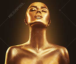Fashion art golden skin woman portrait closeup. Gold, jewelry, accessories. Model girl with golden shiny makeup
