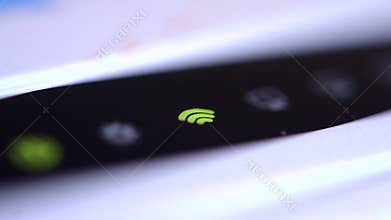 The wifi icon flashes green on the router
